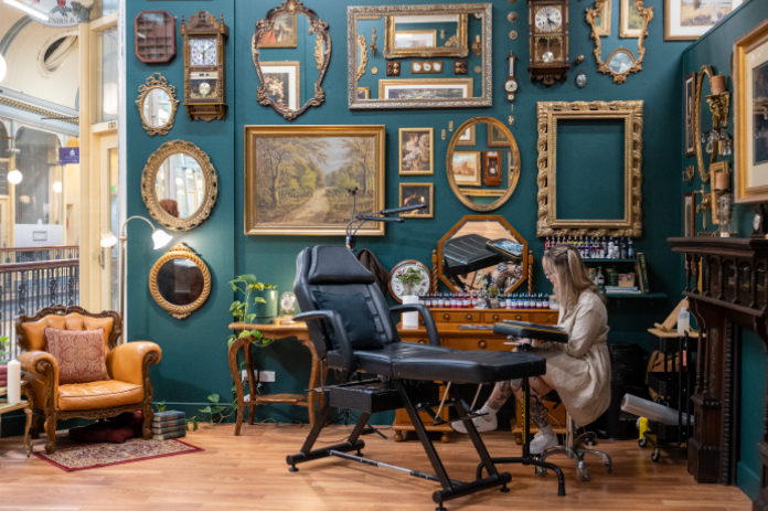 Renew-Activate-1- Gilded Goblin Tattoo Studio with lots of frames and artwork on the wall for Renew Adelaide